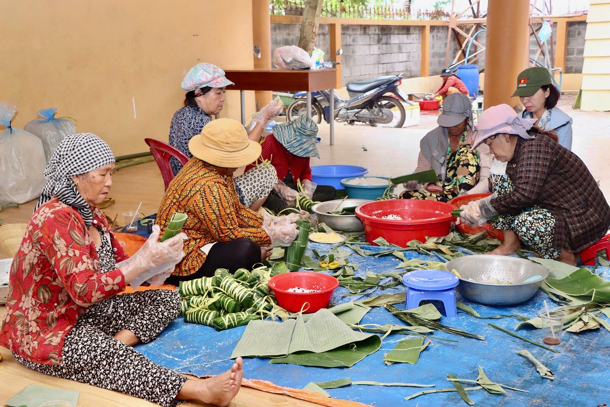 'A group of women sitting on a blue surface

AI-generated content may be incorrect.'