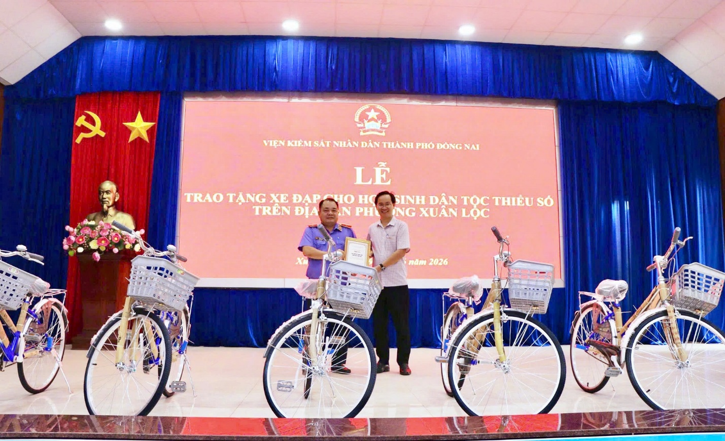 'A group of people standing next to bicycles

AI-generated content may be incorrect.'